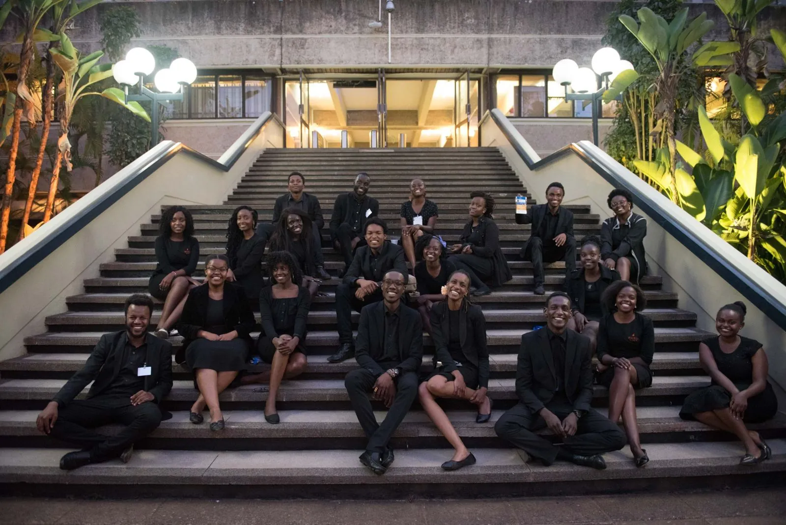 Waridi Events crew in black on the steps of a Nairobi conference venue
