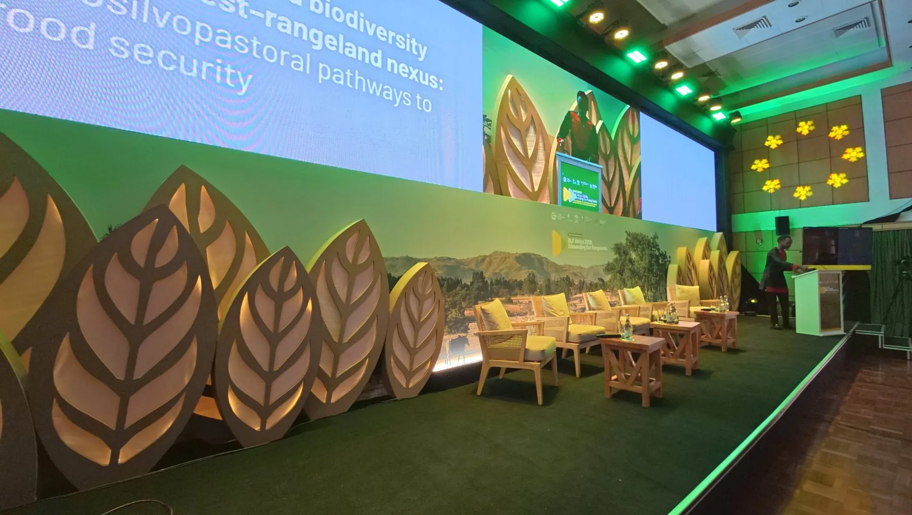 The GLF Africa 2026 stage in Nairobi, with laser-cut leaf panels and panel seating